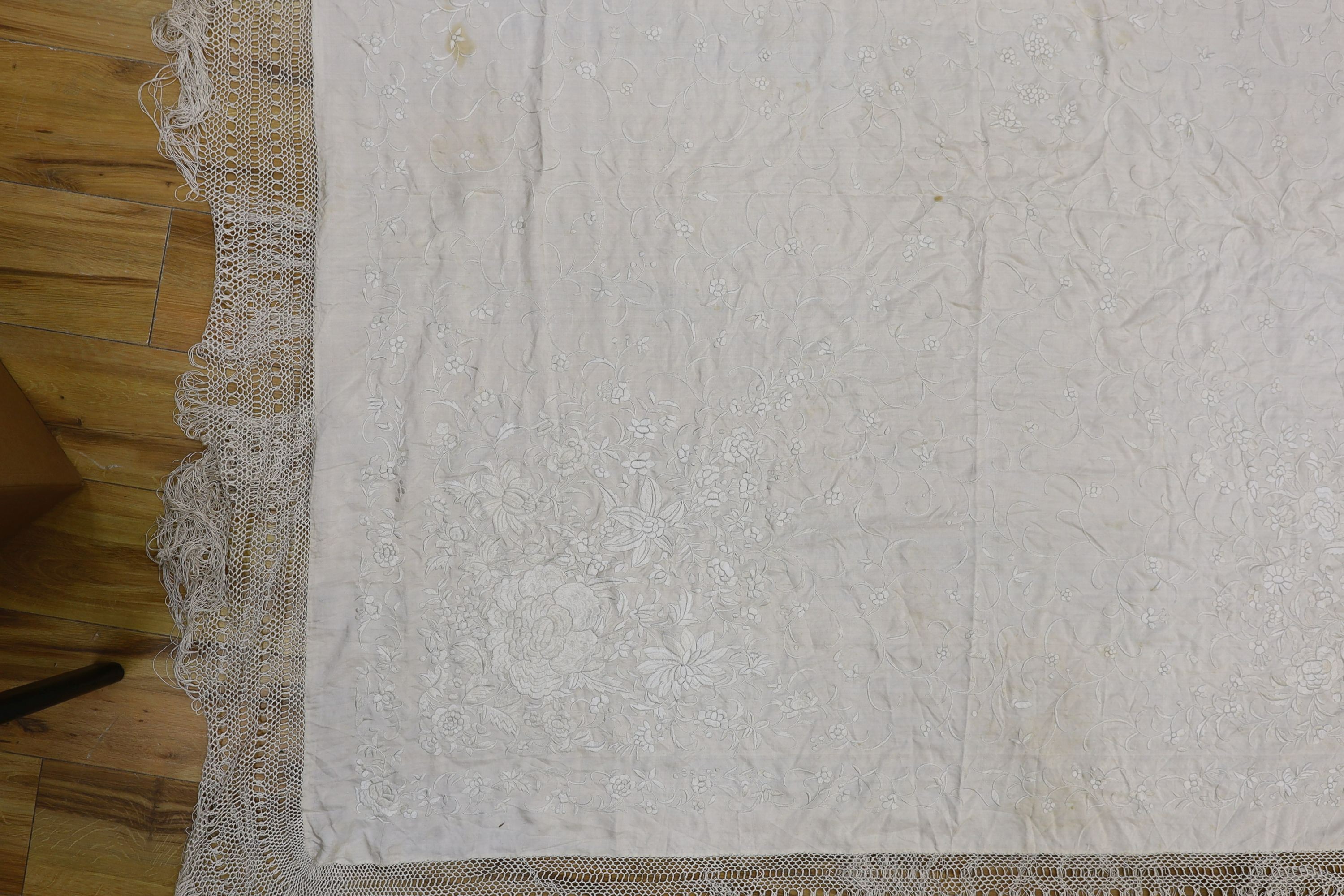 A 19th century cream embroidery on cream silk shawl together with a smaller later shawl